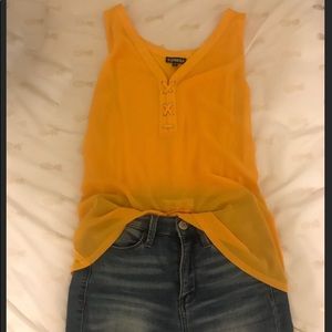 Express : yellow sleeveless shirt.